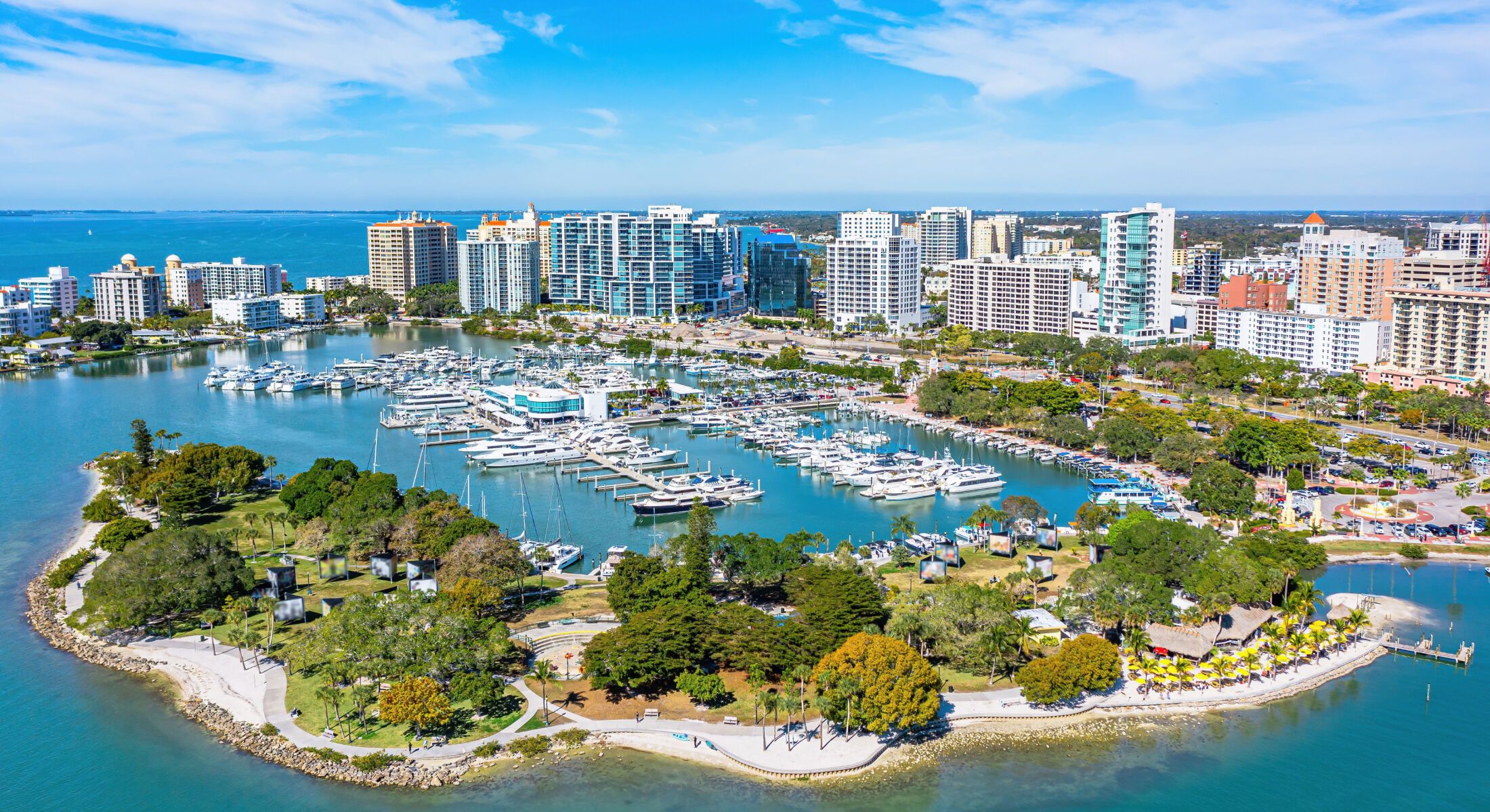 Aerial view of city waterfront and marina.